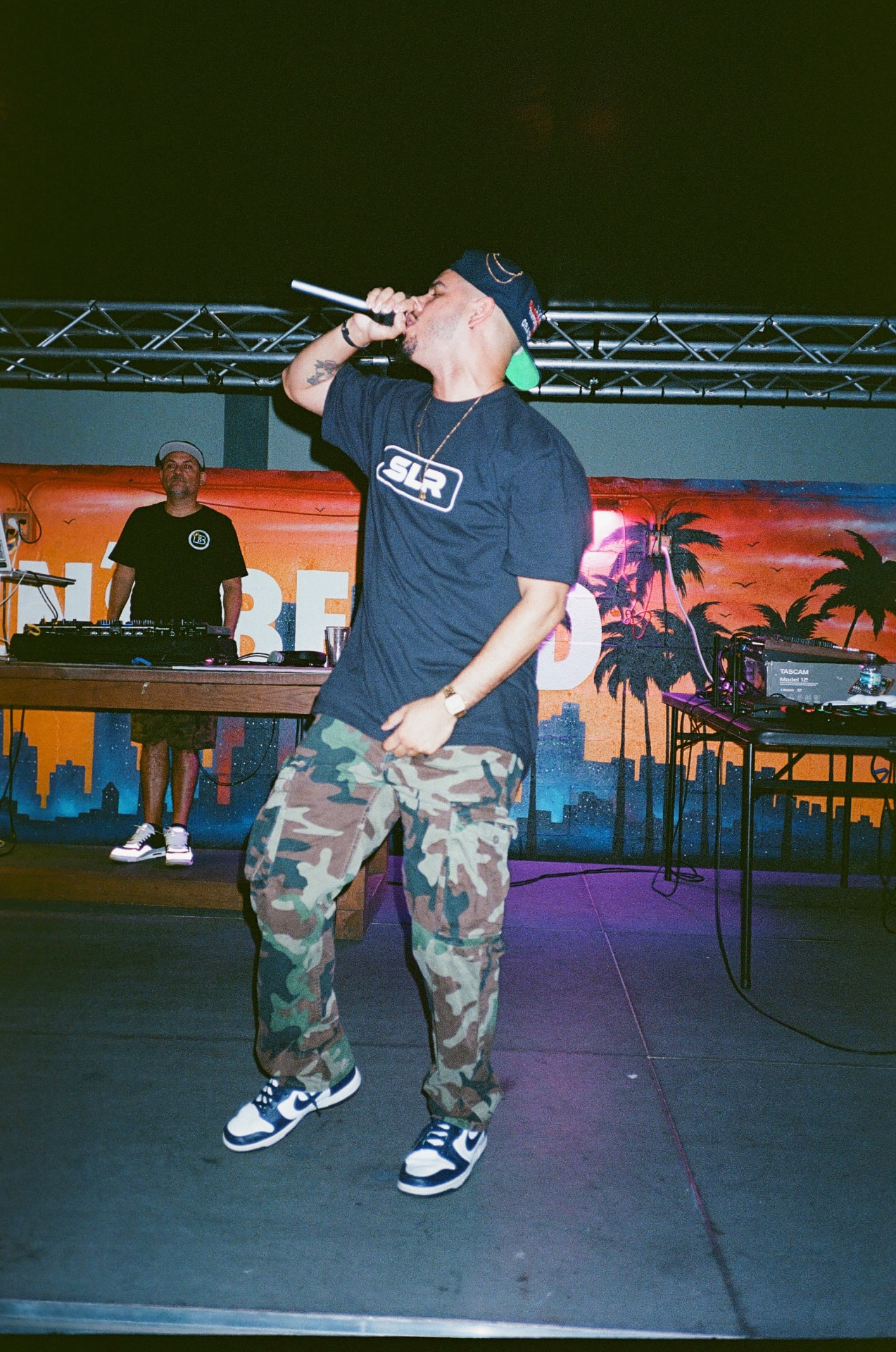 [dru] performing on stage in 2025
